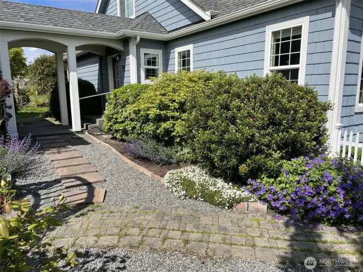 Covered walkway between garage and house.