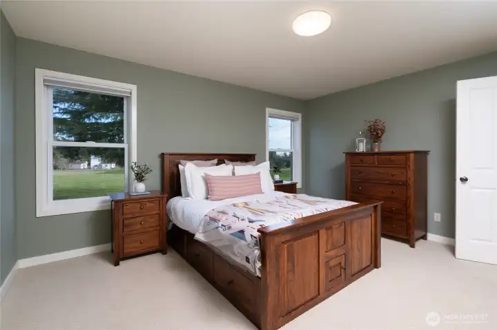 Primary suite with a large walk-in closet.