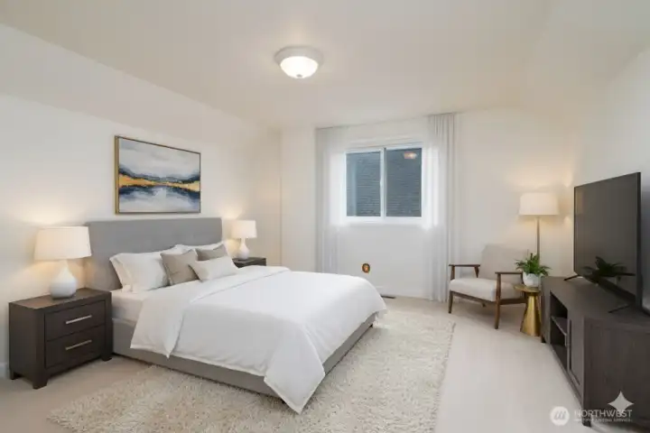 Large bedroom with views of the Olympic Mountains. Virtually staged.