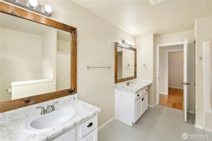 Primary Bathroom with 2 separate vanities, sinks and mirrors. Gorgeous!