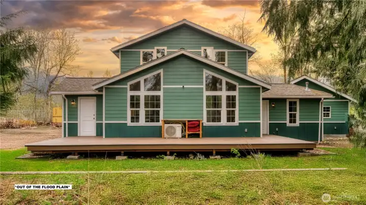 Home is out of the flood plain. An expansive deck offers effortless entertaining.