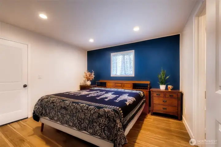 Main floor primary w/ensuite.  Storage & private deck access to left, ensuite to your right.