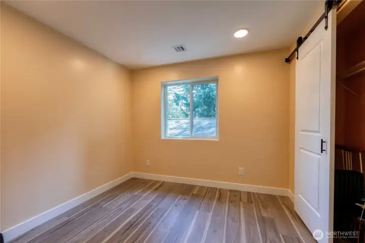 3rd bdrm ~2nd floor bedrooms showcase stylish barn-slider closet doors, easy care LVP floors & bright windows that fill each space with natural light.