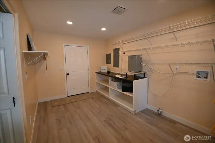 Laundry w/folding area ~ accessible from garage, home and exterior.