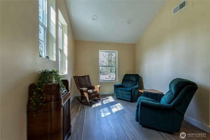 Bonus room provides a quiet, versatile space ~ shown as a cozy sitting room.