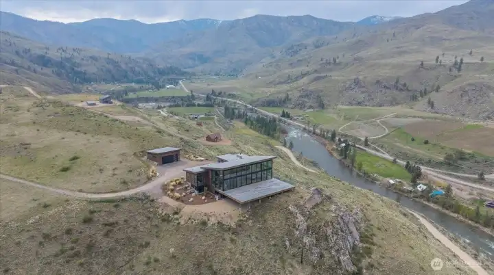 AI generated home on the building pad with 360 views of mountains and Methow River