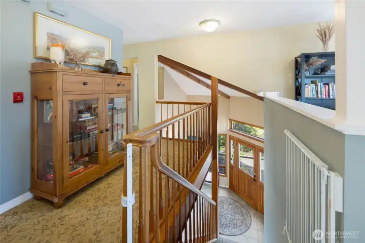 Open second story wood beam vaulted ceilings