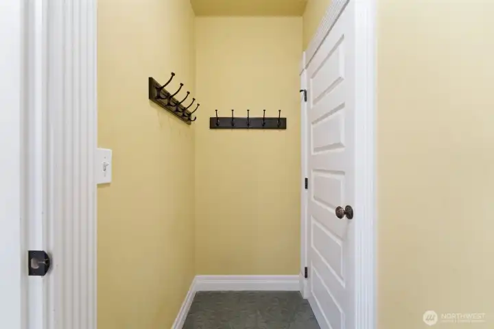 Pantry next to the kitchen or a simple coat room. Take your pick.