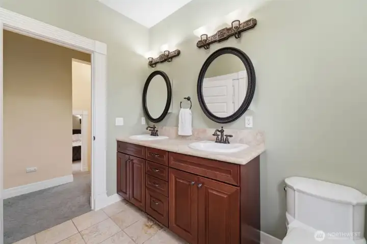 Double vanity sink. Both full bathrooms have marble floors