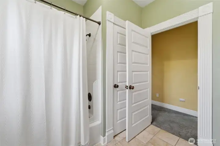 Bathroom has its own closet to store towels