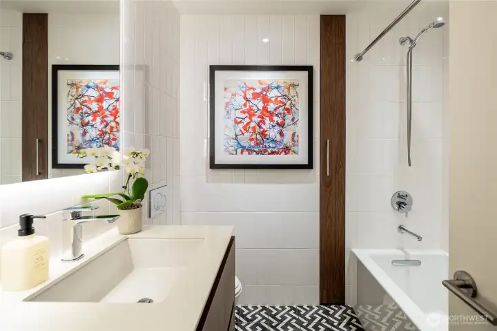 Main floor full bath with heated tile floor. Main floor full bath with heated tile floor.