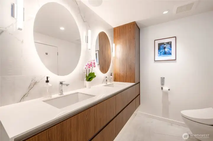 Custom floating vanity with in-drawer electric ports. Custom floating vanity with in-drawer electric ports.