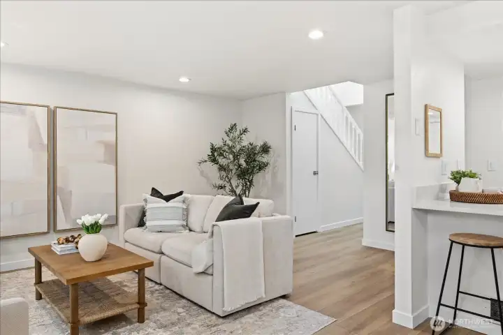 Brand-new luxury vinyl plank flooring brings warmth, durability, and a cohesive modern look throughout the main level.