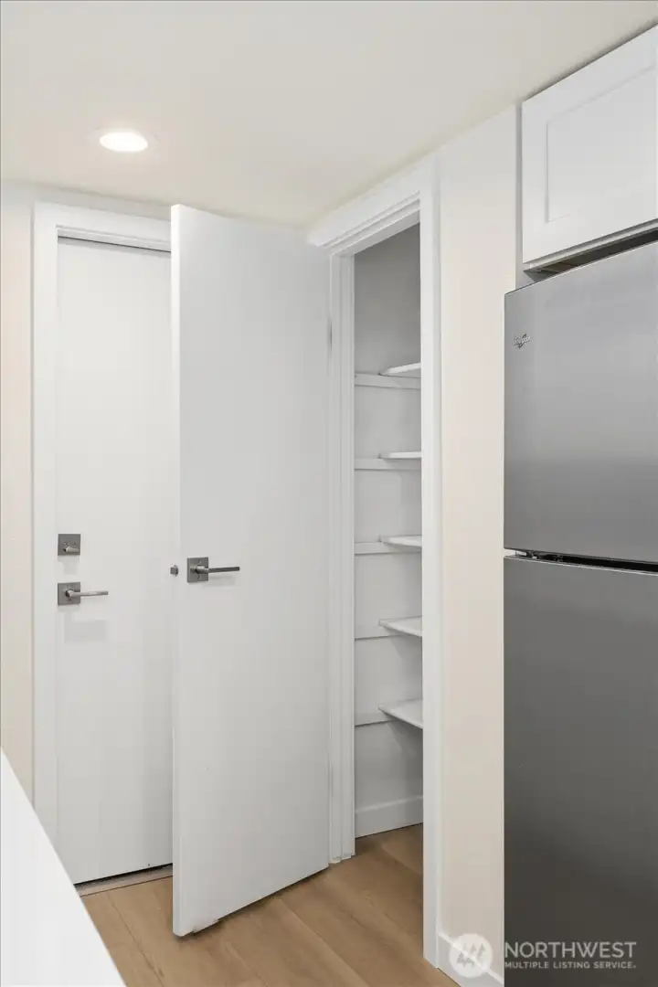 Generous pantry area providing abundant kitchen organization space.