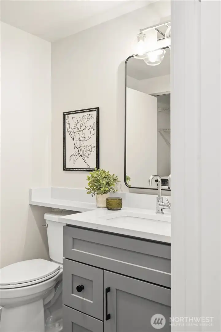 No detail was overlooked, including this beautifully updated powder bath conveniently located on the main level.