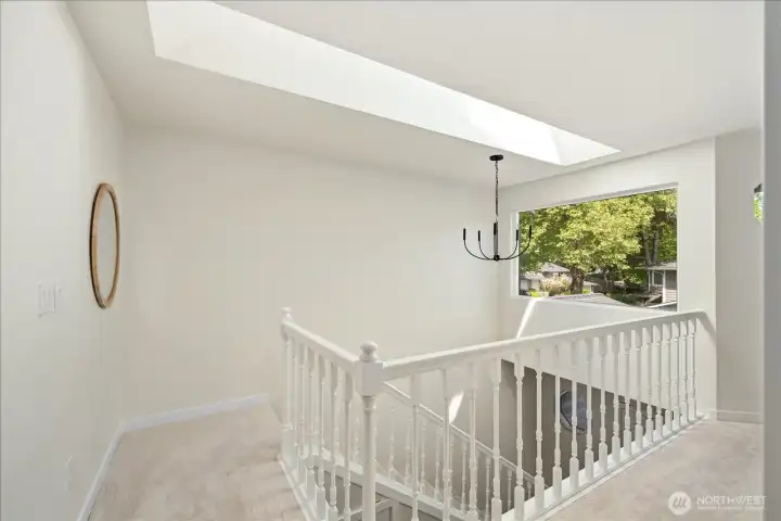 Natural Light: Large triple-pane windows in every room and a strategically placed skylight in the entry/stairwell create a bright, airy atmosphere.