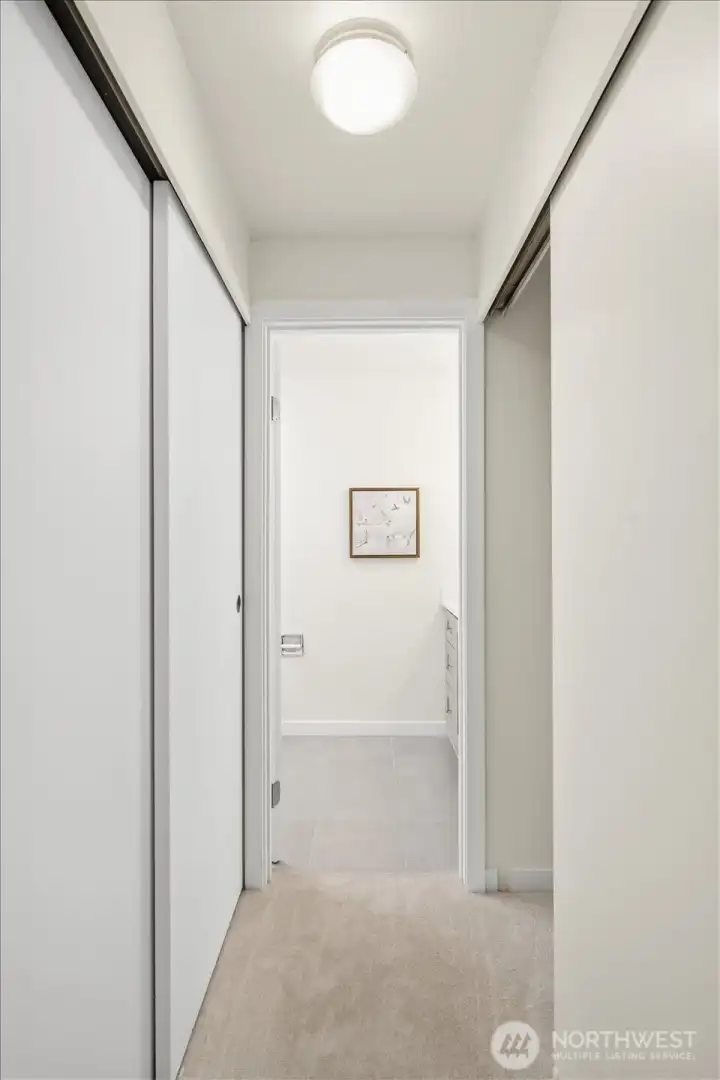 Dual closets provide generous storage in the primary suite, with a refreshed ensuite just beyond.