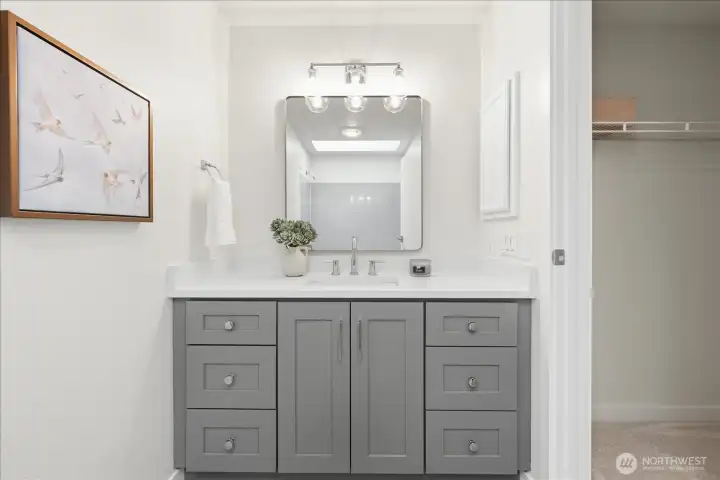 Thoughtfully refreshed for everyday ease, with generous vanity storage and seamless connection to the primary suite’s dual closets.
