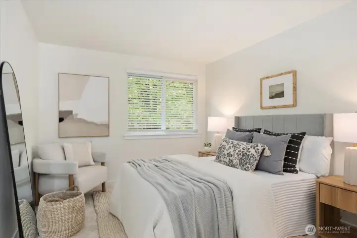 A comfortable secondary bedroom filled with natural light, equally suited for guests, family, or a dedicated home office.