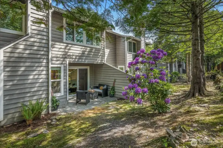Mature trees and established landscaping create a peaceful, tucked-away setting rarely found in townhome living.