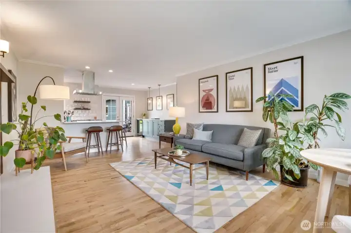 With an open, airy feel, the beautifully designed kitchen becomes the heart of the home, featuring an expansive entertaining bar with added storage, perfect for gathering, serving, and everyday living.