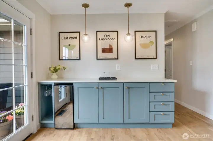 Thoughtfully designed pull-out shelving maximizes storage and functionality, while the beverage fridge just steps from the patio makes summer entertaining effortless.