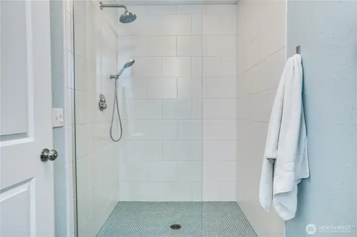 You’ll love unwinding in this spacious custom shower, beautifully finished with soothing coastal-inspired tones that create a spa-like retreat.