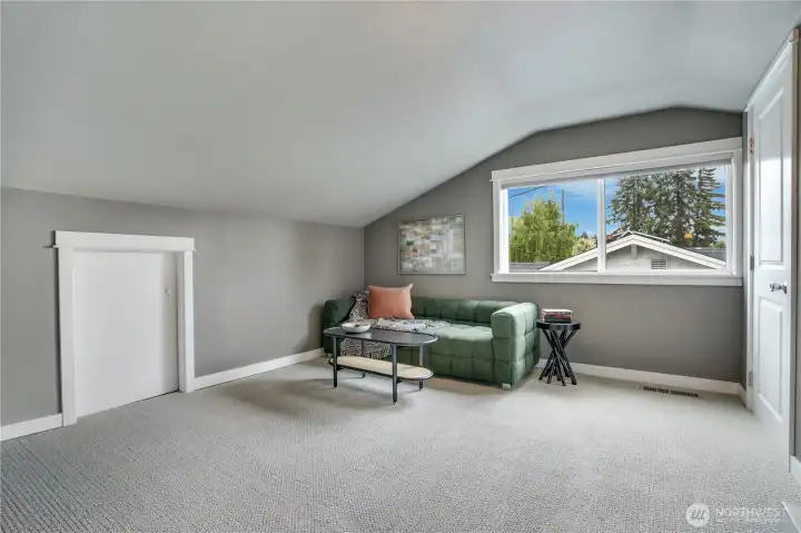 Perfect loft style bedroom, guest room, media or project/office space.  Check out the space behind the closet door!