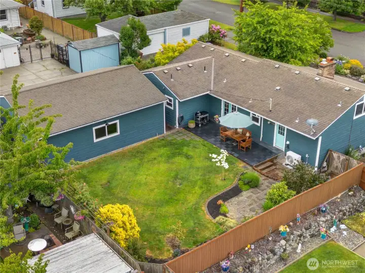 This backyard is fully fenced on a roomy corner lot.