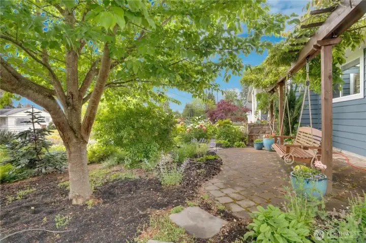 This serene swing and charming trellis create the perfect escape to begin and end your day with peace, reflection, and intention.