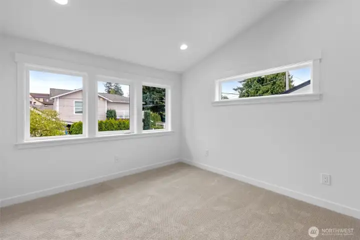 Primary bedroom with ensuite bath and walk-in closet