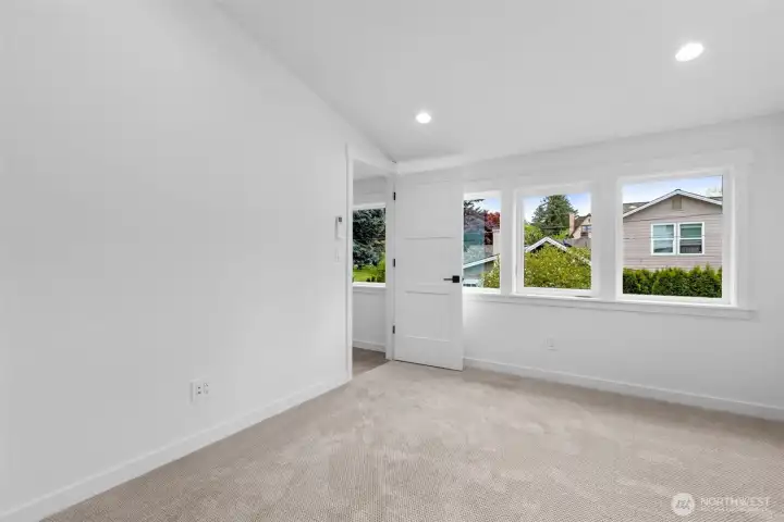 Primary bedroom with ensuite bath and walk-in closet