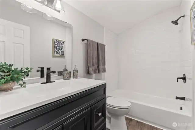 Primary En Suite w/Oversized Vanity and Custom Tiled Shower.