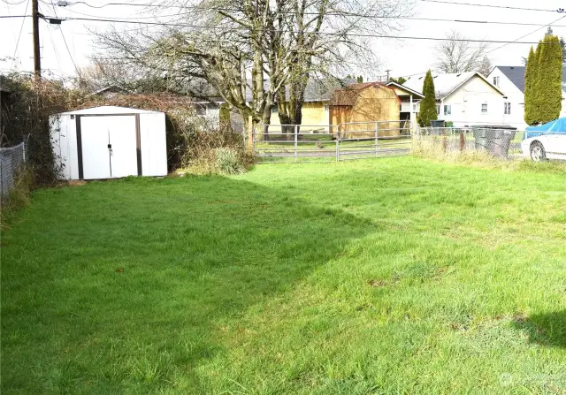 Back yard looking from house to alley showing garden shed