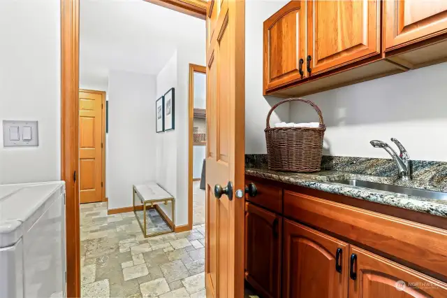 Lower level - 2nd laundry room and storage next to door to backyard and additional storage closet