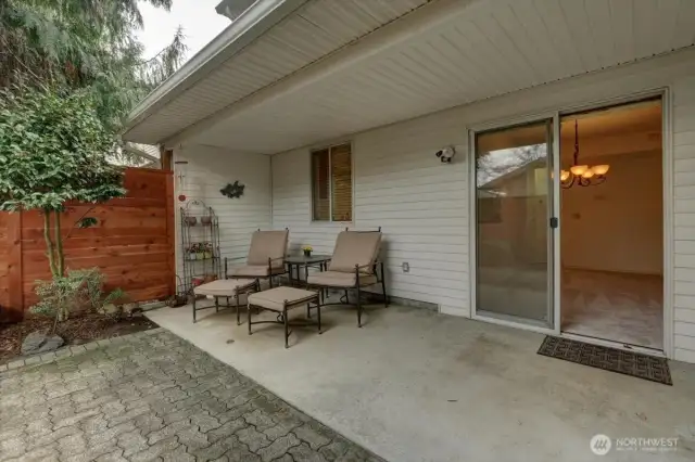 Covered back patio in fully fenced back yard.