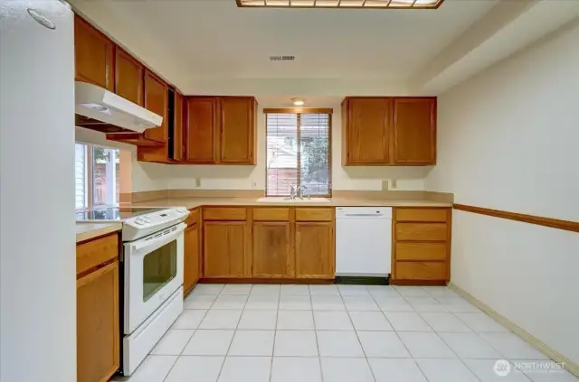 Spacious kitchen with plenty of cabinets and room for casual dining.