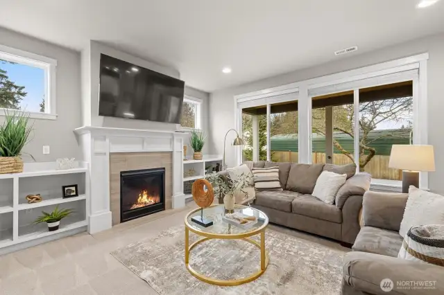 Living room with gas fire and built ins + all new plush carpeting