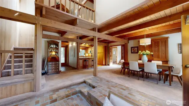 This light-filled yet cozy space has luxury throughout. A view up to the primary suite.