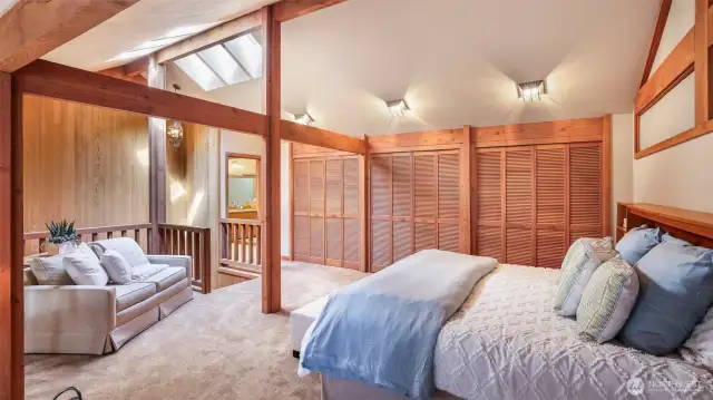 The primary suite features a sitting area and extensive wall of closets.