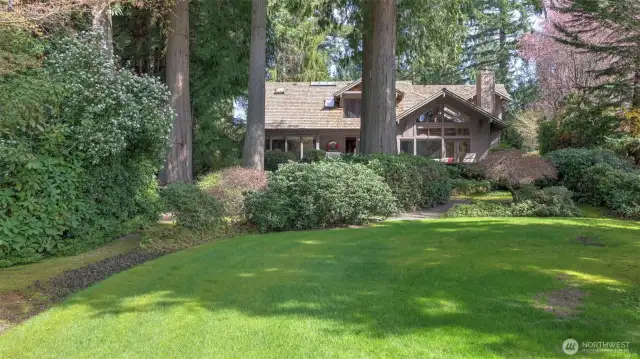 Gently sloping grass leading to your private waterfront.