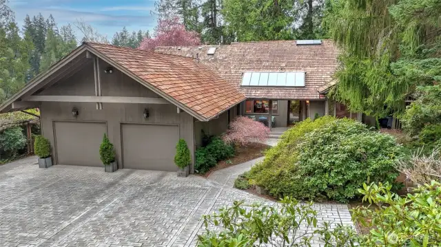 Private driveway leads to a home situated on nearly an acre of property.