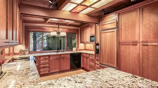Double ovens, a built-in Sub Zero refrigerator, Fischer Paykel dishwasher drawers, and handsome hardwood floors put the finishing touches on a space where cooking is a pleasure.