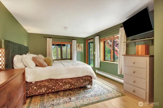 The primary bedroom which has a door to the yard