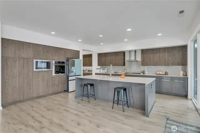 OK, let's talk about this kitchen! A full wall of storage, a wall oven and a wall microwave. It's the best kitchen layout ever.