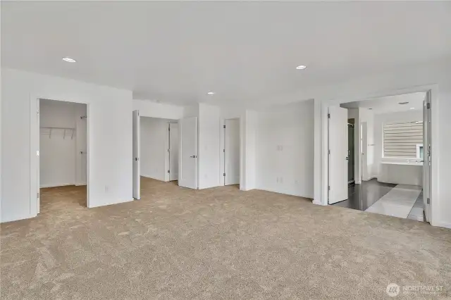 In the Primary bedroom: To the left is walk-in closet #1. To the right of the first walk-in closet is the double-door into the room, to the right of that is walk-in closet #2. There is also a media nook. Double doors into the private bathroom rivals any high-end hotel.
