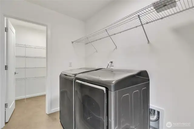 Utility room with another storage room.