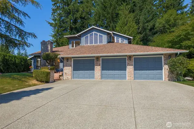 Abundance of parking! Three car garage with storage galore, including a pull-down ladder for attic storage access.