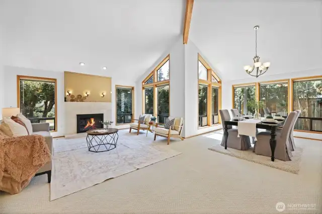 Formal living and dining room with clean lines and rich wood beam accents.