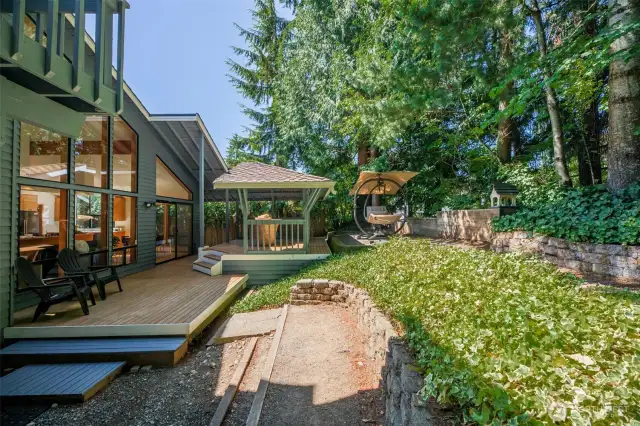 Tree-lined backyard and multiple decks for you to enjoy.